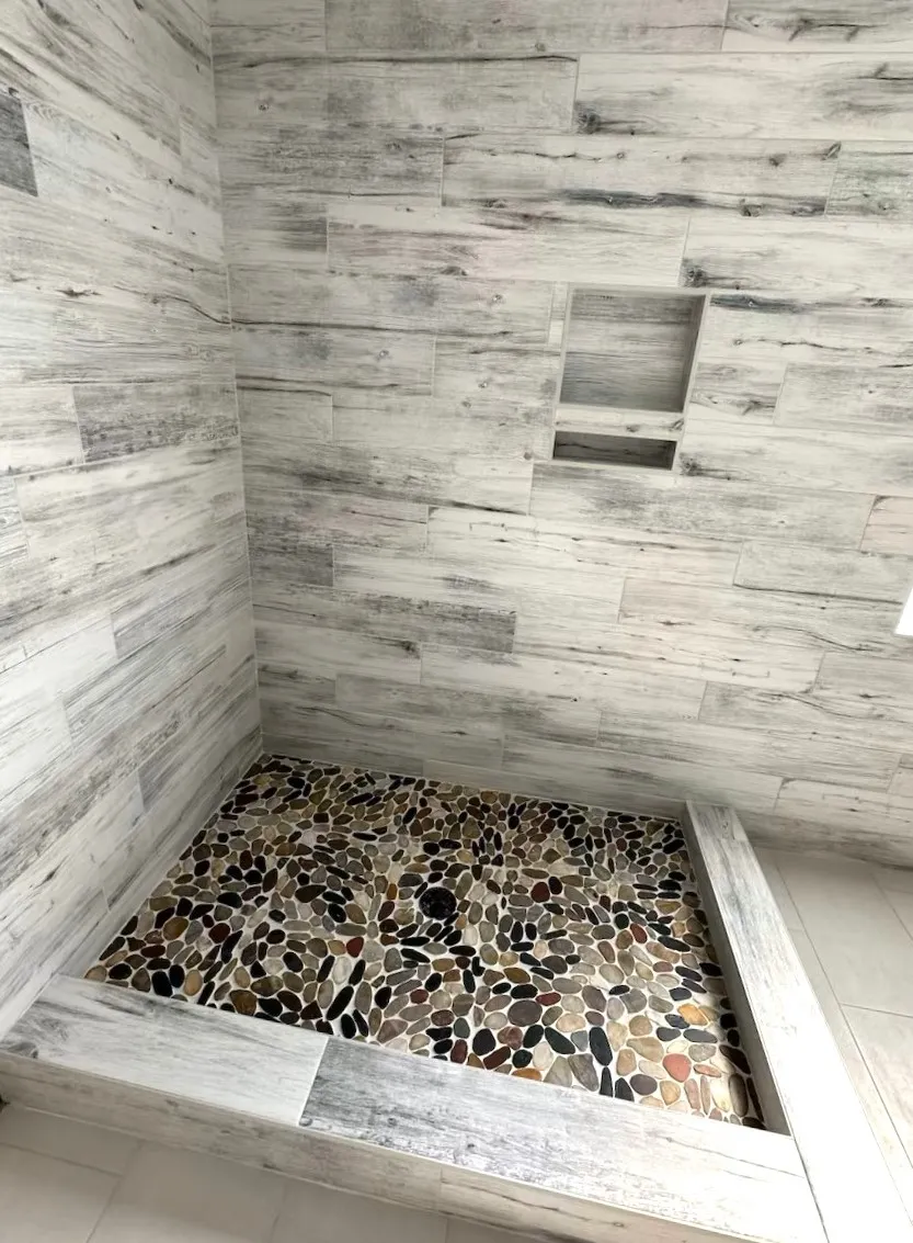 BRIANS-FLOORING-PRESTIGE-MADISON-BAYOU-PORCELAIN-WALL-TILE-EMSER-RIVERA-FLAT-PEBBLES-MOSAIC-SHOWER-FLOOR Flooring | Brian's Flooring & Design