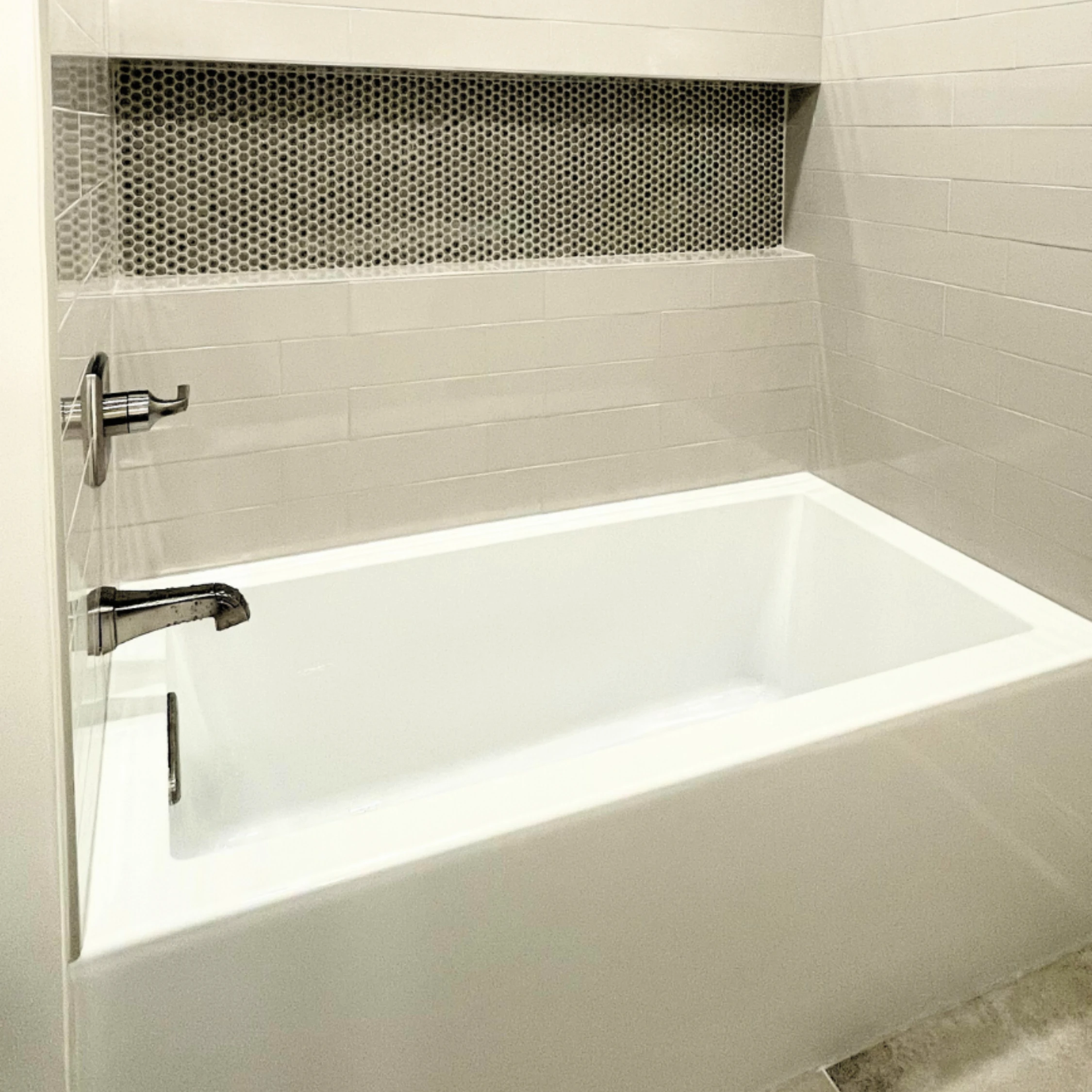 Tile floor, tub surround, and niche