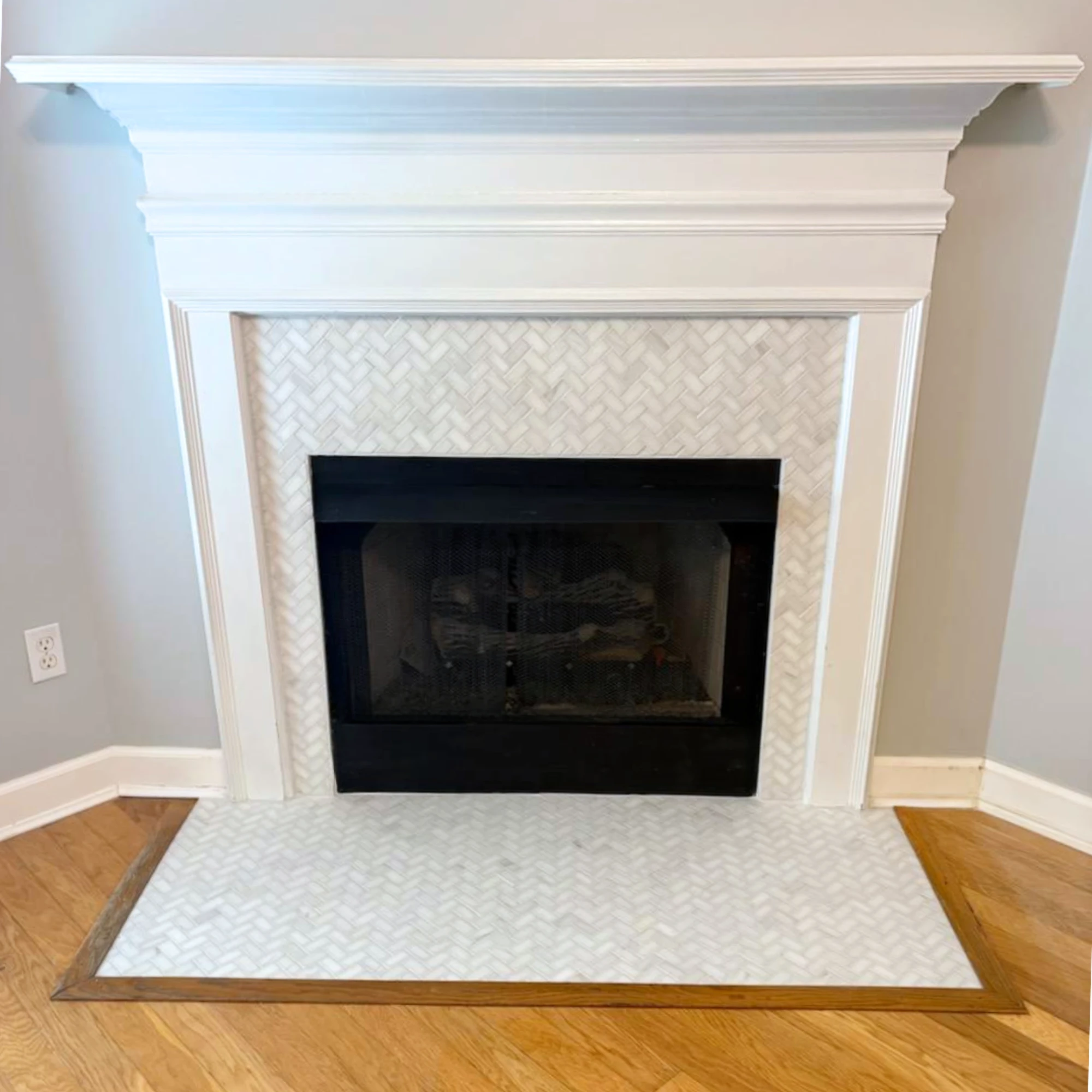 Tile herringbone fireplace surround