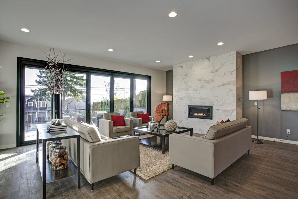 Living room featuring wood look laminate flooring.