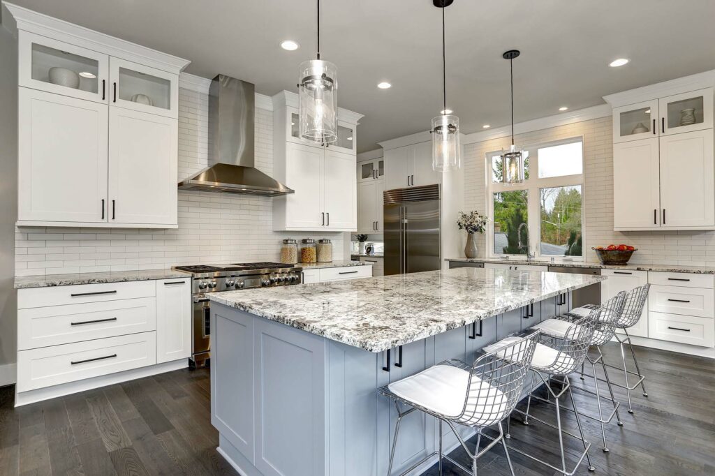Contemporary kitchen showing coordinated countertops, cabinets, backsplash, and flooring